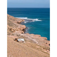 Red Bluff Quobba Station Western Australia - left hand point break peeling into deep turquoise Indian Ocean - lone stone shack on red hillside - Coral Coast fine art photography - Josh Whiting