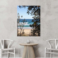 Gallery wrap canvas print, Australian coastal wall art showing a turquoise wave viewed through banksia branches on the NSW South Coast