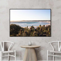 Black floating frame canvas of Wharton Beach, bold coastal wall art with a contemporary edge