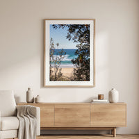 Coastal wall art print, turquoise wave breaking at Ulladulla, NSW South Coast, photographed through banksia trees and native coastal scrub