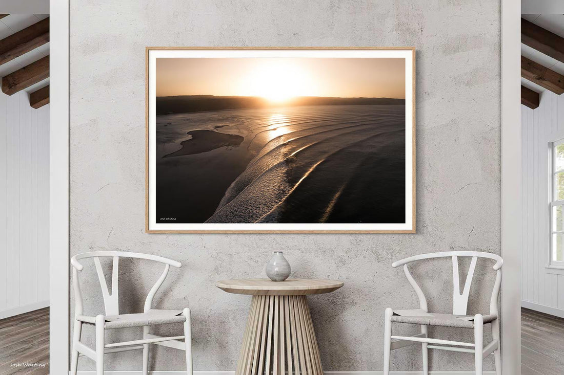 Warm oak framing suits the golden light in this Double Island Point wave shot, a natural fit for timber interiors