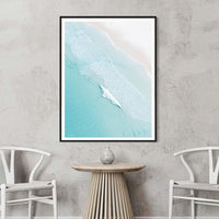Black framed Open Coast print, bold contrast against the turquoise water and pale sand