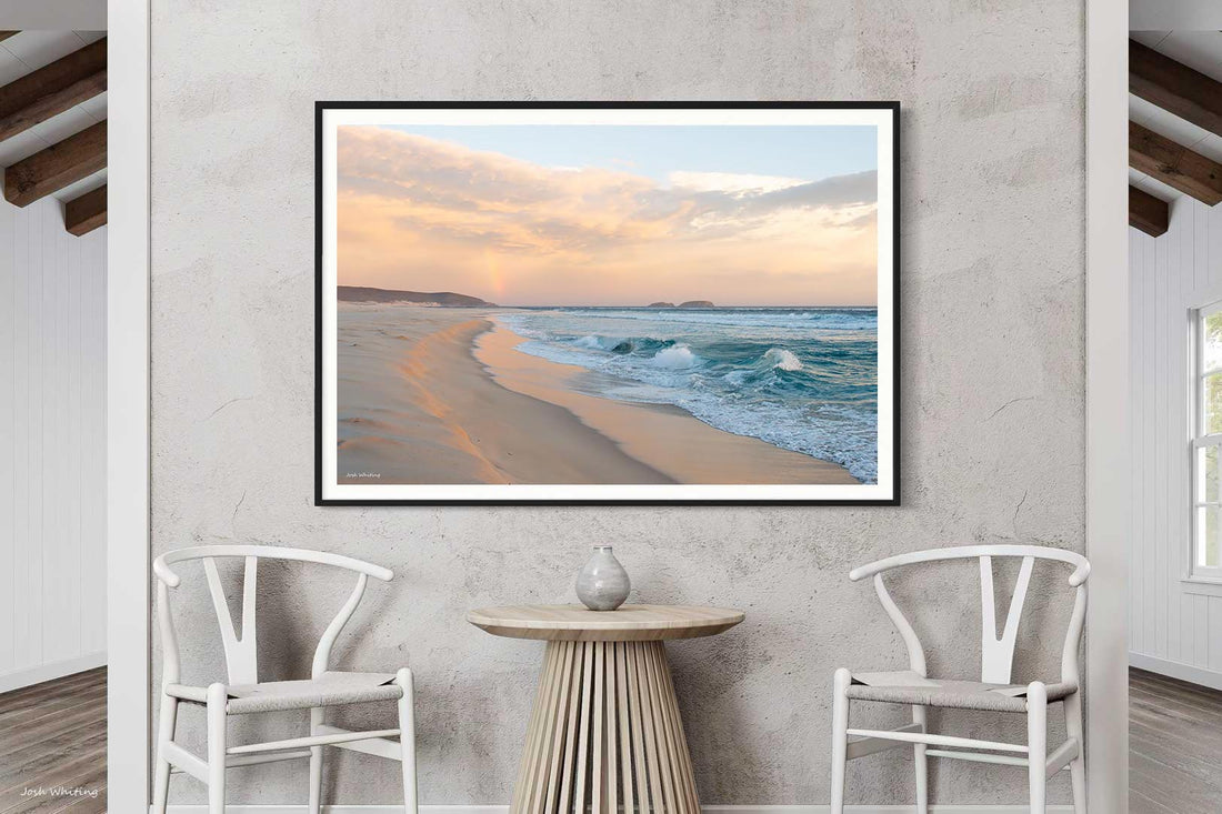 Black framed landscape print, high-contrast Australian wall art of a rainbow over the coast