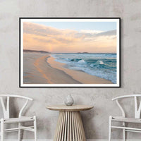 Black framed landscape print, high-contrast Australian wall art of a rainbow over the coast