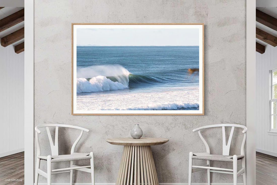 Oak framing suits the warm tones of this Sunshine Coast barrel shot, surf wall art with a natural finish