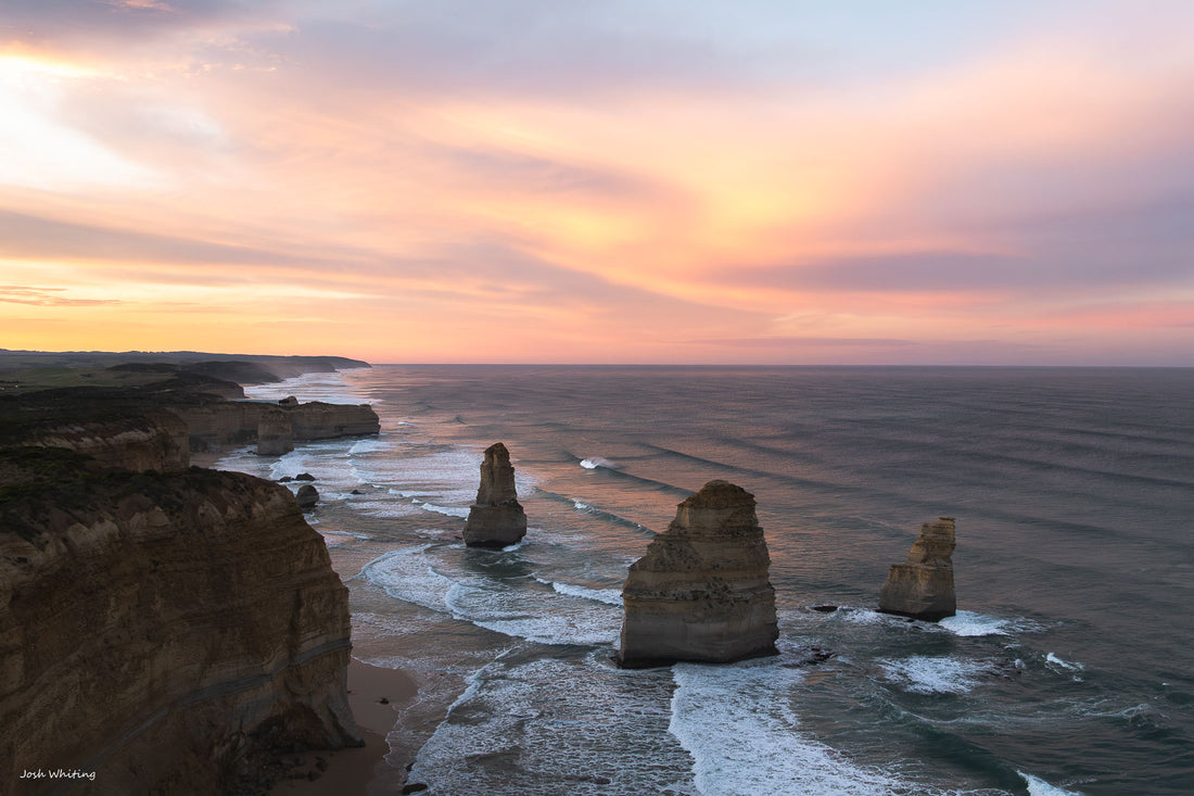 Twelve Apostles sea stacks glowing at sunrise, Port Campbell National Park on Victoria's Great Ocean Road