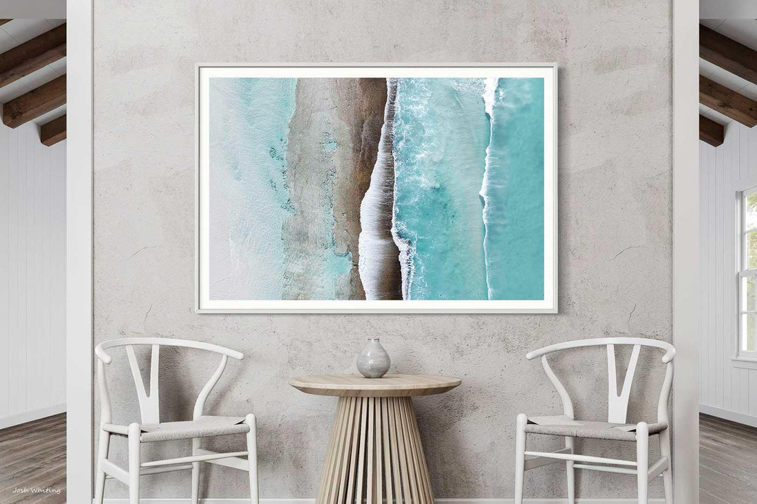 A large wall art piece in a white frame, fine art coastal photography ready to hang
