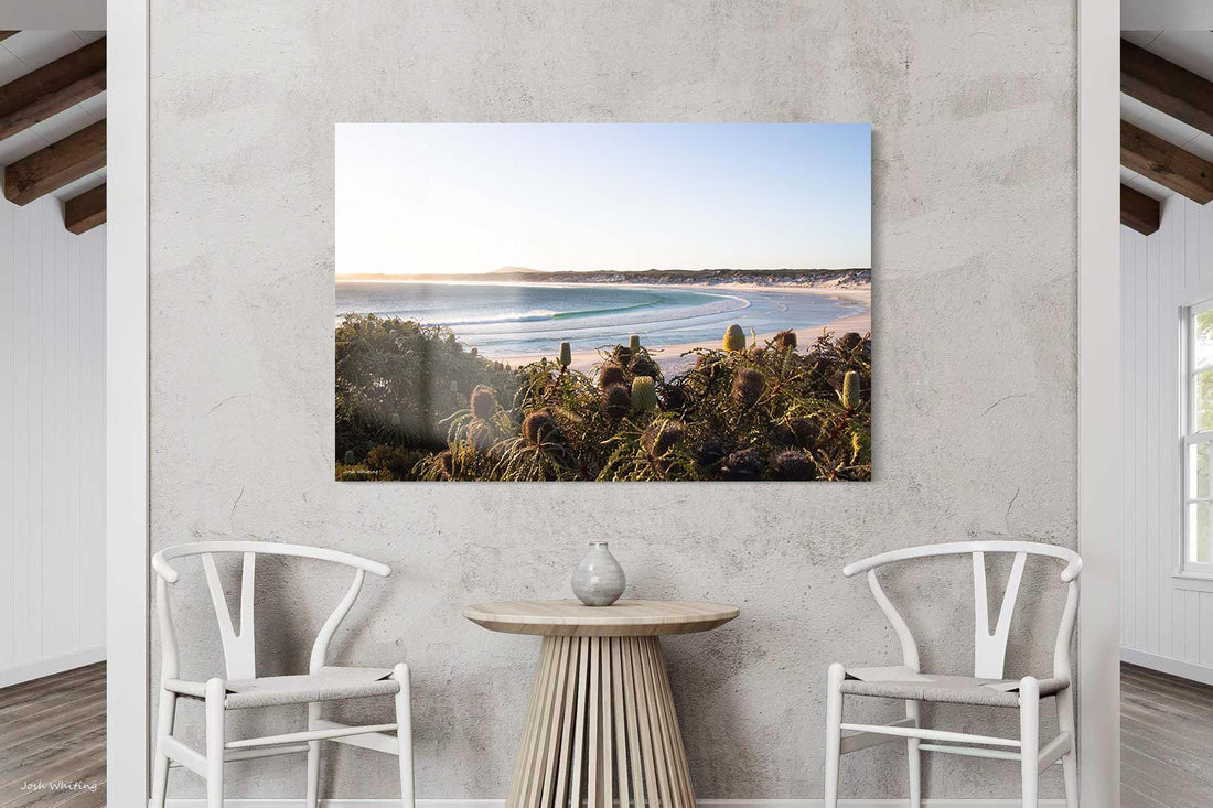 Frameless acrylic print of Wharton Beach, glossy finish that lifts the turquoise water and wave texture